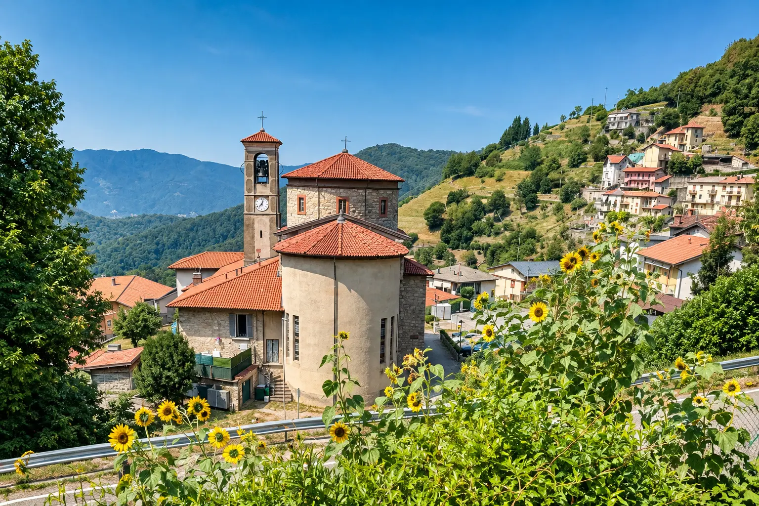 Vista dal terrazzino sulla chiesa, il paese e le montagne